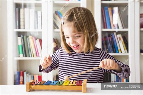 Portrait Of Happy Little Girl Playing Xylophone — Musical Instrument