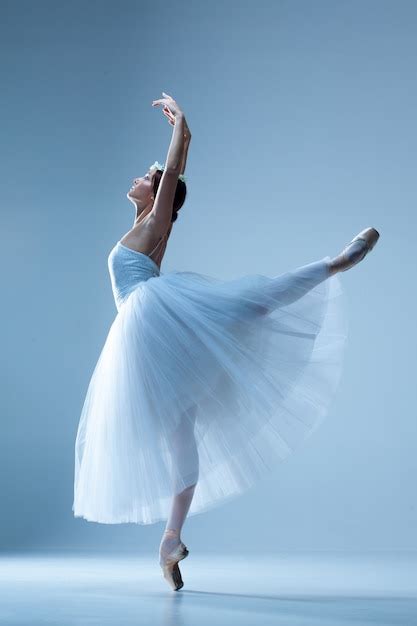 Classic Ballerina Dancing On Blue Free Photo