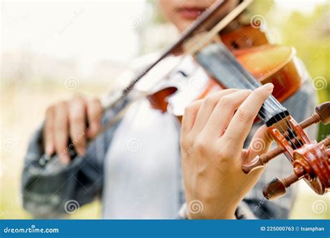 Close Up Portrait Of Young Asia Woman Music Violinist Hand Play Violin