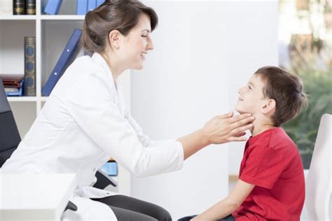 Pediatrician Examining Lymph Nodes Stock Photo By ©photographeeeu 56196637