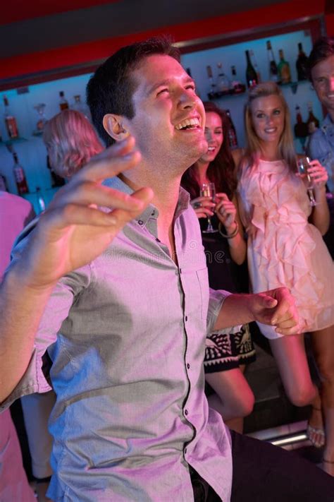 Young Man Having Fun In Busy Bar Stock Photo Image Of Enjoying