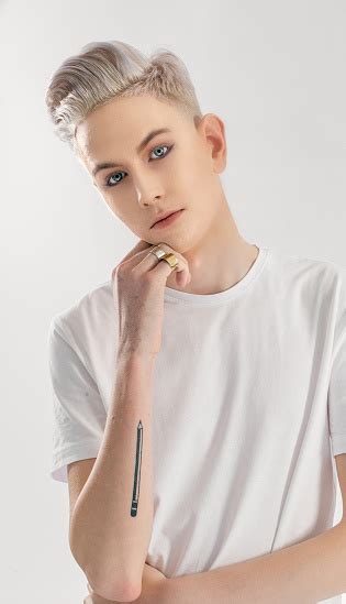 The term nonbinary was created as a reaction to the societal binary dividing human beings into males and females. Studio Portrait Of A Young Nonbinary Individual In White ...