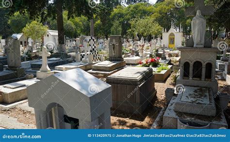 Graveyard Tombs With Crosses And Angel Statues At The Cemetery