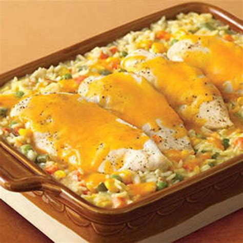 Baked chicken and rice may not sound like the most exciting recipe in your arsenal but this may be one you come back to time and time again (we do). Cheesy Chicken & Rice Casserole - Rachael Ray Every Day