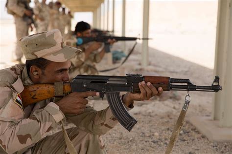 An Iraqi Army Soldier Fires An Ak 47 Assault Rifle Nara And Dvids