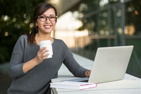 Pretty Female Student Smiling Happy Browsing The Internet On College
