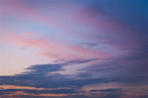 Colorful Sunset Sky Over The Horizon Layered Clouds Stock Photo