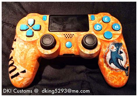 An Orange Controller With Dolphins On It