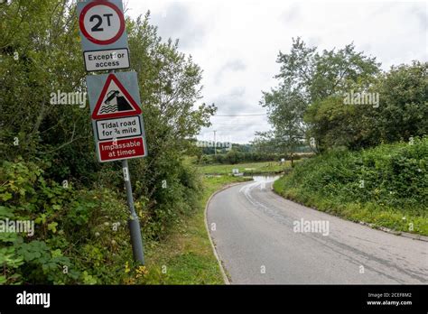 Warning Signs Tidal Road Aveton Ford Stock Photo Alamy