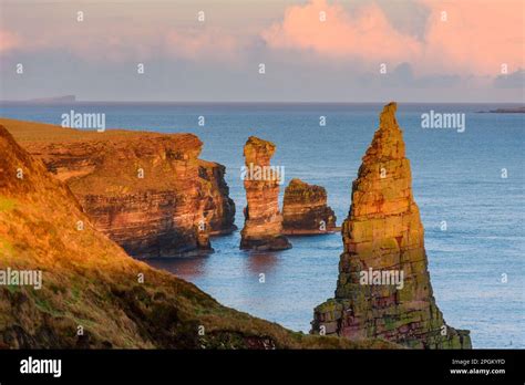 The Knee Sea Stack Centre Off Duncansby Head At Sunset From The