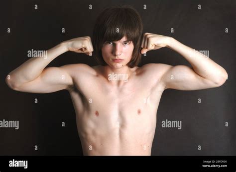 Boy Flexing Biceps High Resolution Stock Photography And Images Alamy