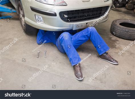 Mechanic Working Under Car In Garage Stock Photo 124822381 Shutterstock