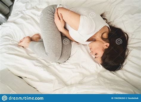 Woman With Closed Eyes Lying In A Fetal Position Stock Image Image Of