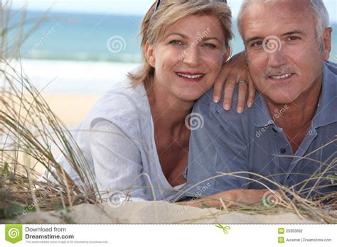 Middle Age Couple Photography Couple Lying In The Sand Dunes Older