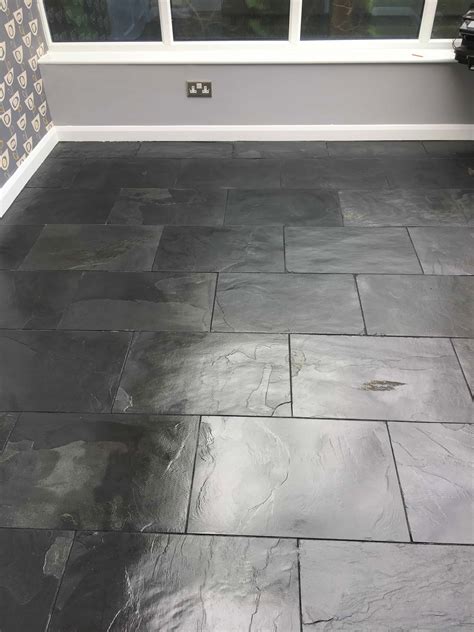 Add more water if the stain's still heavier then you would prefer) use a yellow grout sponge (found in the tile section of your local home depot) and cut it in half so that it fits your hand perfectly. Black Slate Tiled Floor Stained by Decorators in Hampton - South Middlesex Tile Doctor