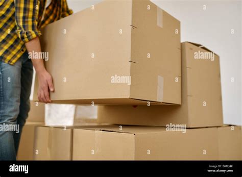 Closeup Hand Lifting Box During Home Moving Stock Photo Alamy