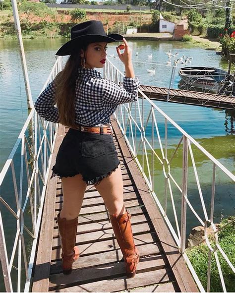 Cowgirl Outfit With Shorts And Hat On Stylevore