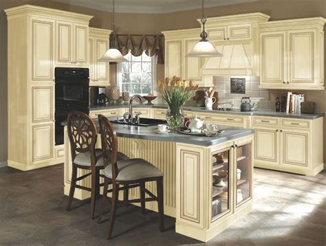 This dark cherry stain is able to turn any room into a home oasis. Kitchen idea #3: distressed cream cabinets, this has tile ...