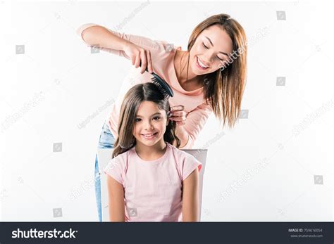 Girl Combing Hair Over 62191 Royalty Free Licensable Stock Photos