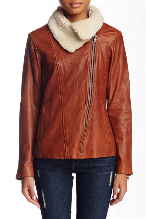Check out our camel leather jacket selection for the very best in unique or custom, handmade pieces from our clothing shops. SOIA & KYO Removable Faux Shearling Collar Leather Moto ...