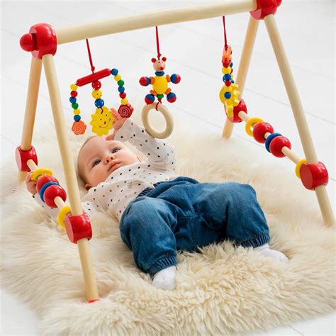 Guide pour acheter un portique en bois pour bébé ...