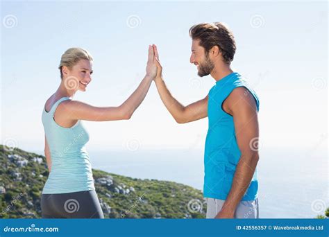 Fit Couple Standing High Fiving Stock Image Image Of Outdoors Sporty