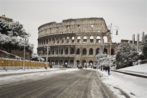 Via Dei Fori Imperiali And The Colosseum With Snow Editorial Stock
