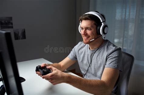 Man In Headset Playing Computer Video Game At Home Stock Photo Image