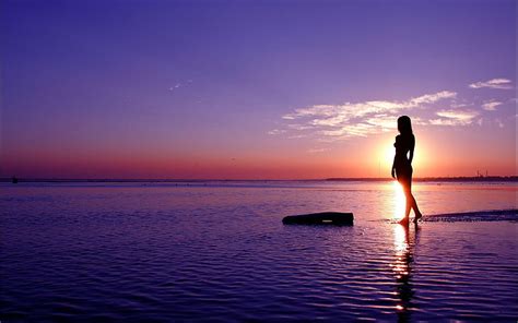 Silhouette Photo Of Woman Standing Beside Seashore Sea Girl Sunset