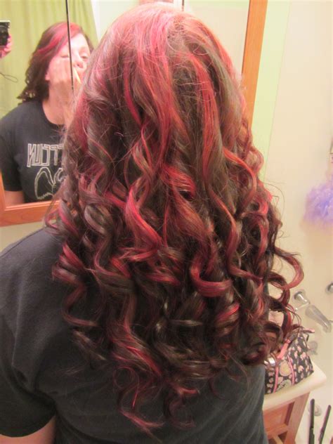 dark hair with chunky red highlights