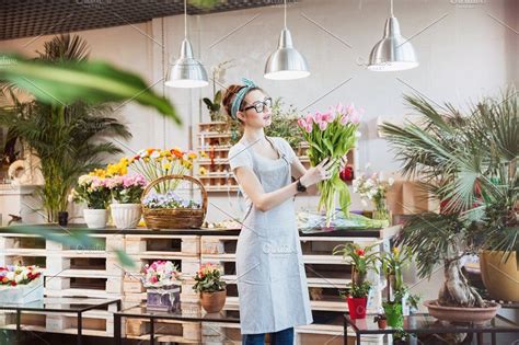 The flower bundles can then be hung from a nail, coat hanger, or some other object that will hold once removed from the glycerin, if the plant looks a bit wilted, it can be hung upside down so that the. Woman florist standing and holding bunch of pink tulips
