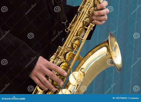 Close Up Of Street Saxophone Player Hands Playing Alto Sax Musical