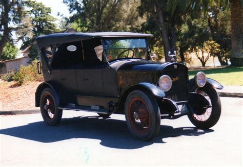 Stanley steamer and other american cars at a parade. BangShift.com 1920 Stanley Steamer