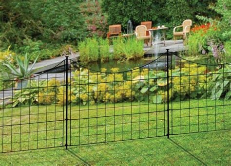 Metal fence and concrete wall. 25in Black Metal Wire Zippity Garden Fence
