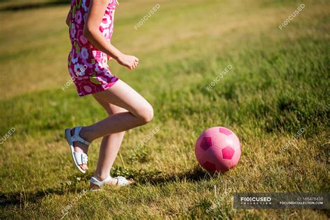 Girl Playing Soccer In Field — One Person Happiness Stock Photo