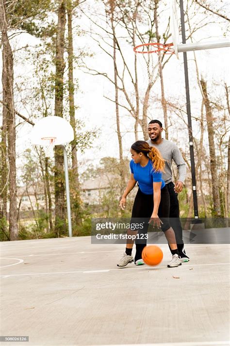Sports Young African Descent Couple Play Basketball At Urban Park High