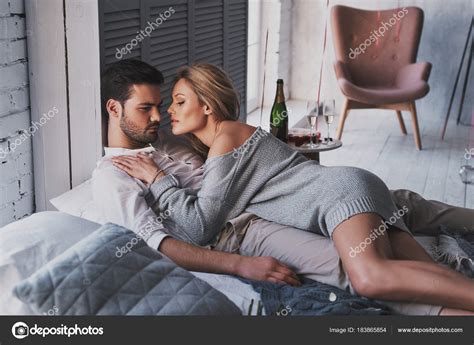 Caucasian Ethnicity Couple Love Embracing While Lying Bed Home — Stock Photo © gstockstudio ...