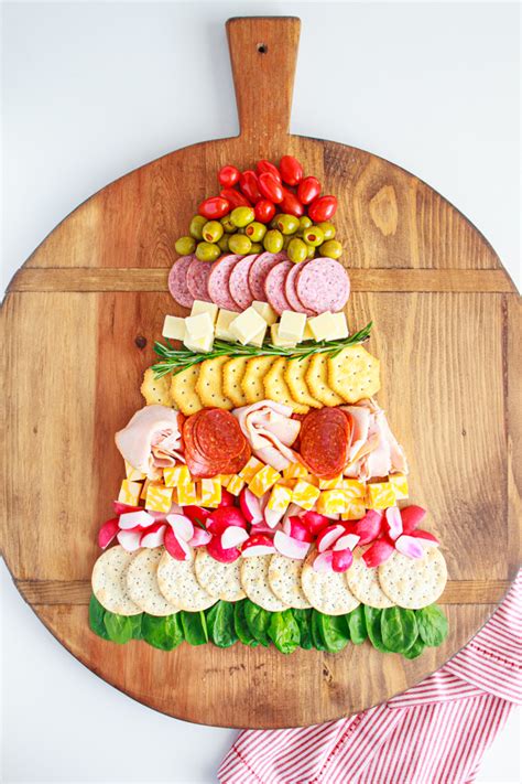 Simply roll sweetened cream cheese and chocolate chips inside pieces of pillsbury™ crescent dough, and then shape the whole thing into a pull apart christmas tree to bake. Christmas Tree Cheese And Cracker Tray | By My Name Is ...