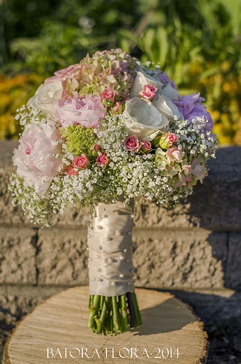 Baby's breath is inexpensive, so if you build a bouquet with it, go big or go home! Large bridal bouquet-Mix of roses, hydrangeas, peonies and ...