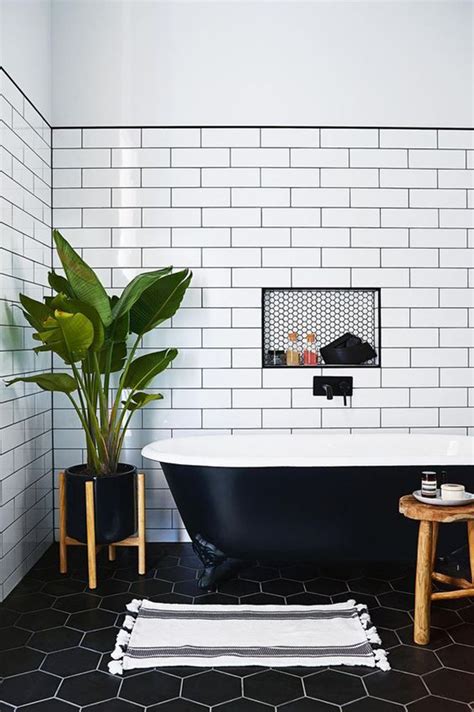 The mix of white subway tiles on the wall with the black and white penny floor tiles are classic choices for bathrooms old and new. The Peak of Très Chic: Needing, Wanting, Loving: Tiled ...