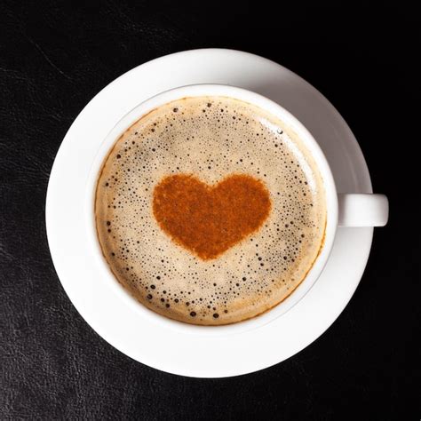 Premium Photo Cup Of Coffee With Heart Shaped Foam