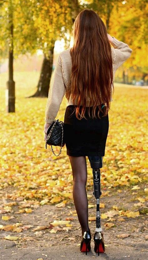 A Woman Walking In The Park On Crutches
