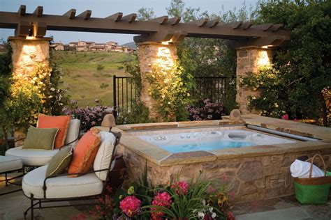 Make Your Backyard Beautiful By Surrounding A HotSpringSpas Hot Tub With Natural Stone This