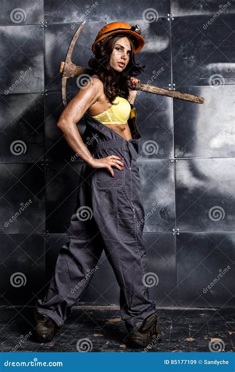 Female Miner Worker With Pickaxe In Coveralls Over His Naked Body Erotic Industry Concept