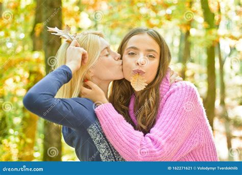 Best Friends Walk At Autumn Forest Beautiful Blonde Girl Kissing Her