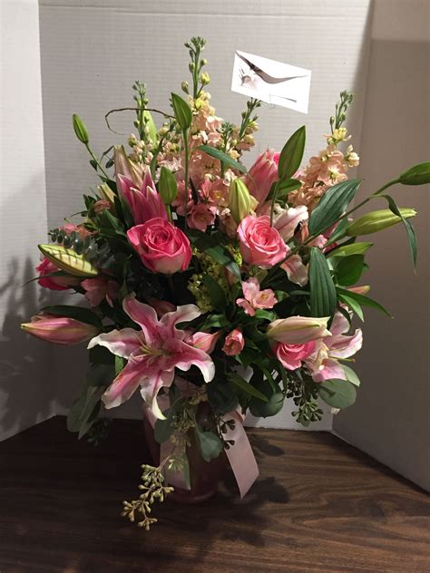 Memorial Arrangement In Vase With Lilies Roses Stock Mums Etc