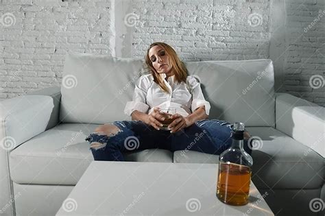Sad Depressed Alcoholic Drunk Woman Drinking At Home In Housewife