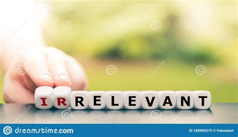 Hand Turns Dice And Changes The Word Irrelevant To Relevant Stock Image ...