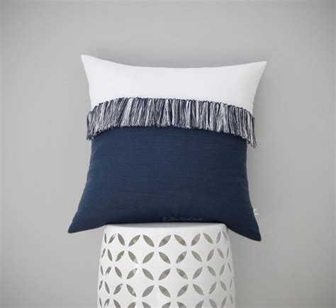 With this pillow tassel diy, courtesy of annie sloan, you can accessorize your throw pillow in a matter of minutes—we promise. Fringe Tassel Pillow in Navy & Cream by JILLIAN RENE DECOR - Jillian Rene Decor