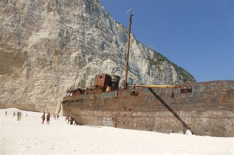 This Rotting Wreck Resting On A White Sandy Beach Is A Major Tourist